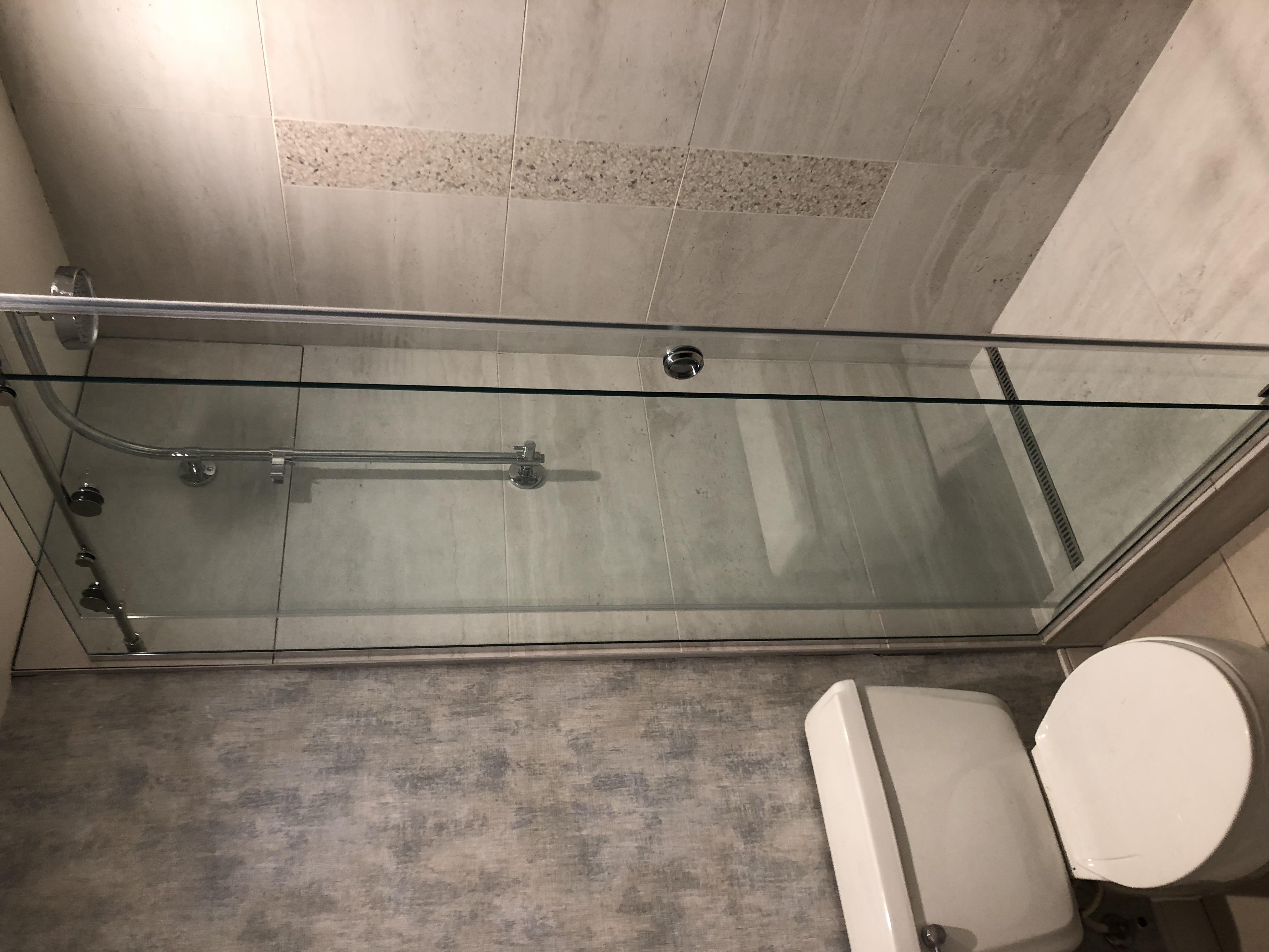 Renaissance Phoenix Downtown Hotel guest bathroom featuring large-format tile